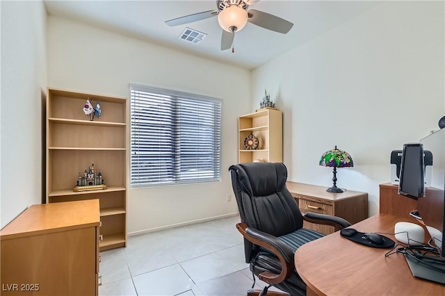 tiled home office featuring ceiling fan