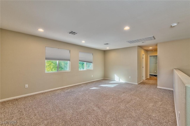 empty room featuring light colored carpet