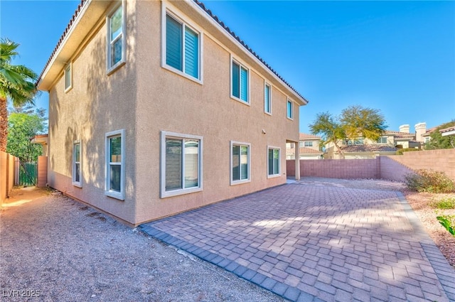 view of side of property featuring a patio