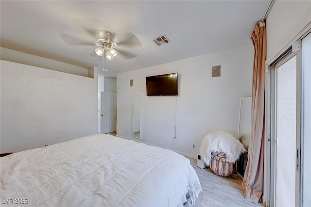 bedroom featuring ceiling fan and light hardwood / wood-style flooring