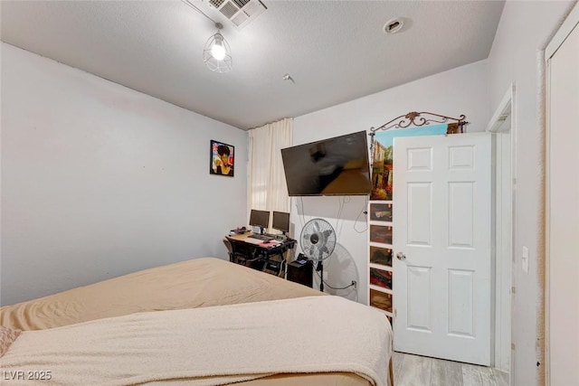 bedroom with light hardwood / wood-style flooring