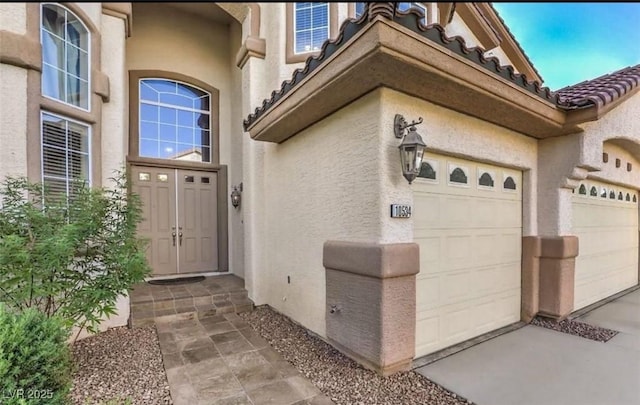 entrance to property featuring a garage