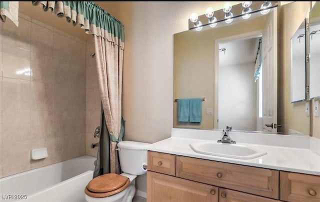 full bathroom featuring shower / tub combo with curtain, vanity, and toilet