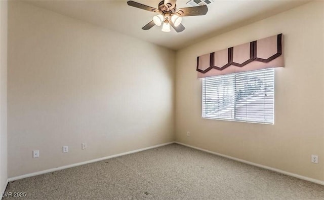 carpeted spare room featuring ceiling fan