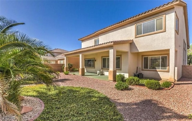 back of property featuring a patio area