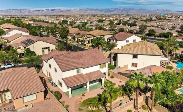 birds eye view of property featuring a mountain view