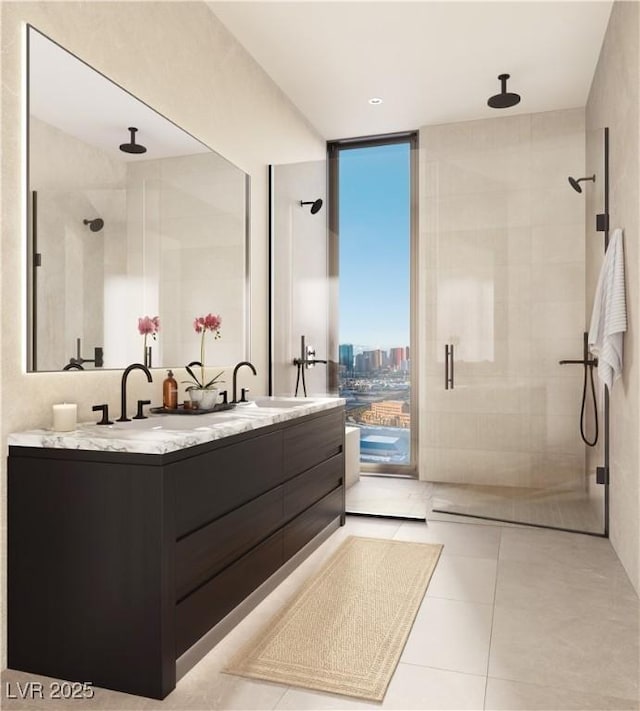 bathroom featuring a shower with door, vanity, tile patterned floors, and expansive windows