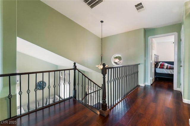 staircase with hardwood / wood-style flooring