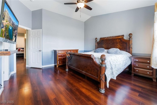 bedroom featuring vaulted ceiling, dark wood-type flooring, and ceiling fan