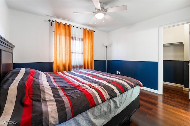 bedroom featuring a closet, ceiling fan, and dark hardwood / wood-style flooring