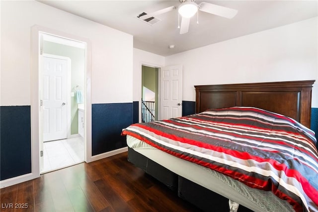 bedroom featuring ensuite bathroom, ceiling fan, and dark hardwood / wood-style flooring