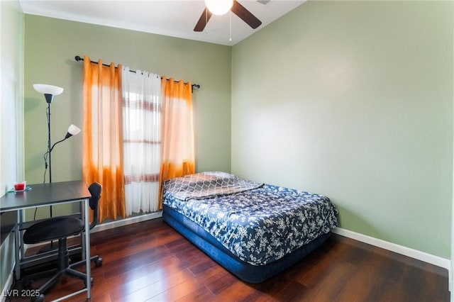 bedroom featuring ceiling fan and dark hardwood / wood-style floors