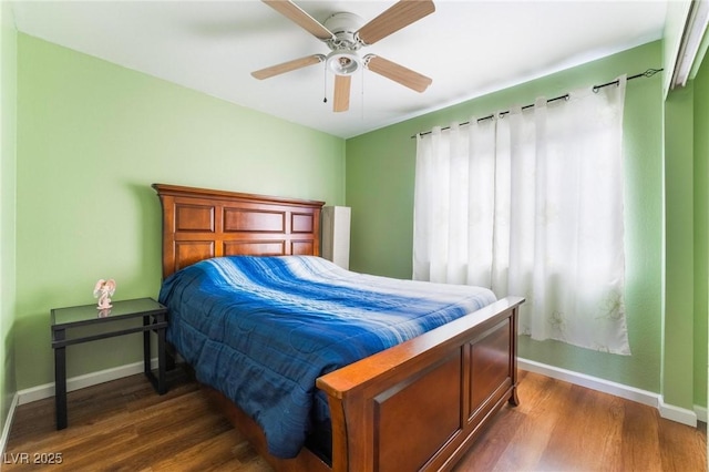 bedroom featuring ceiling fan and dark hardwood / wood-style flooring