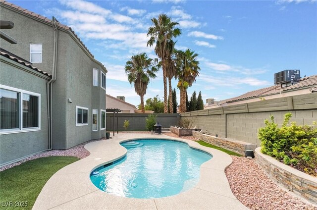 view of swimming pool featuring a patio area and central AC