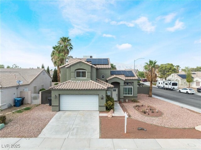 mediterranean / spanish-style home featuring solar panels