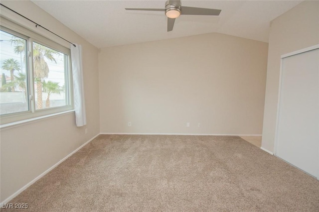 unfurnished room featuring lofted ceiling, light carpet, and ceiling fan