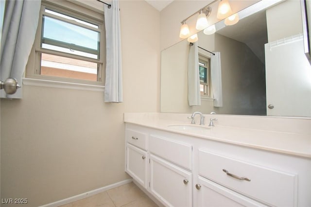 bathroom featuring tile patterned flooring and vanity