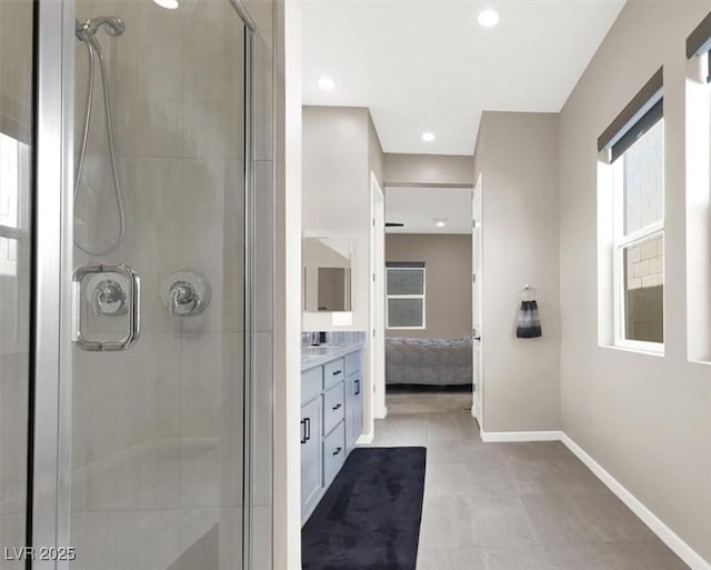 bathroom featuring an enclosed shower and vanity