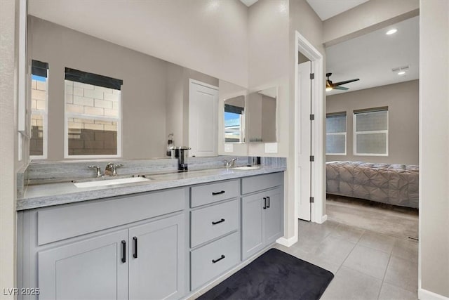 bathroom with ceiling fan, tile patterned floors, and vanity