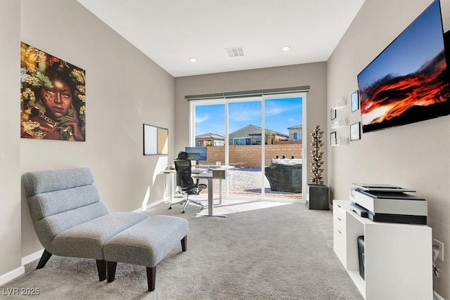 living area with light colored carpet