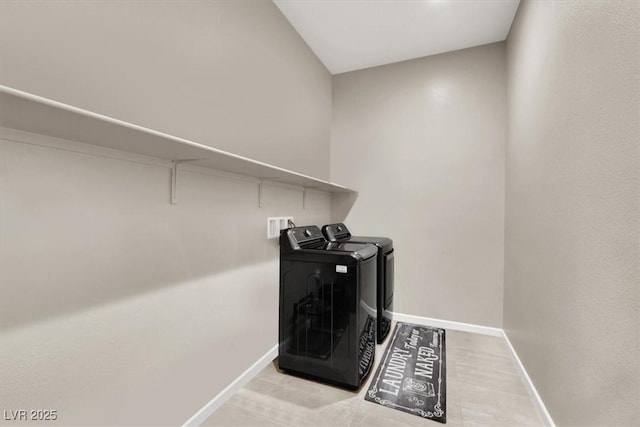 clothes washing area with independent washer and dryer