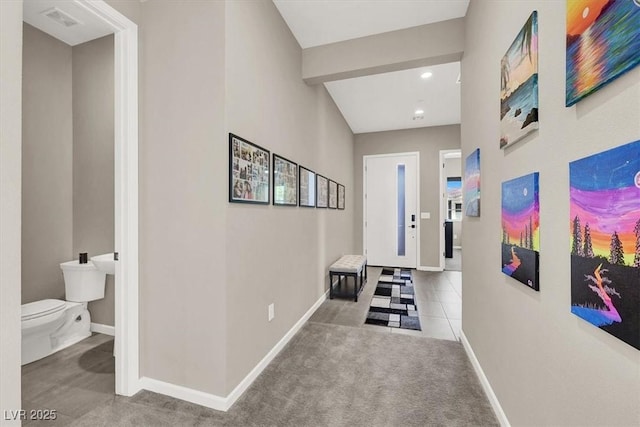 hallway with carpet floors