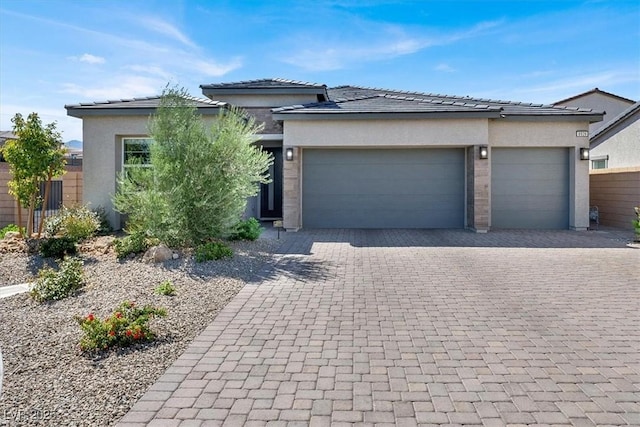 prairie-style home featuring a garage