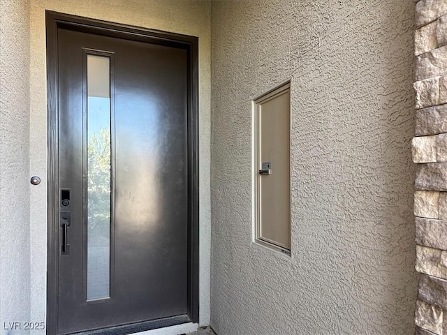 doorway to property with elevator