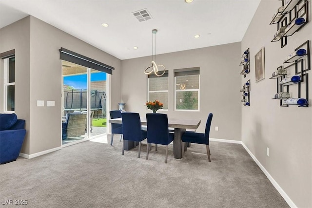 dining space with carpet floors