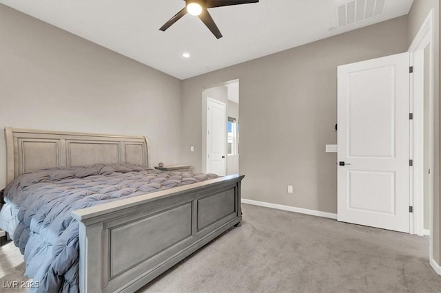 bedroom with ceiling fan and light carpet