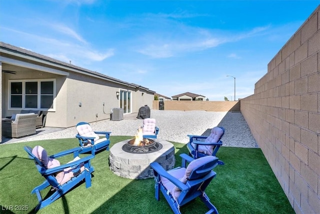 view of yard featuring an outdoor fire pit, a patio area, and cooling unit