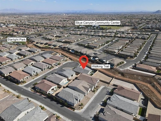 birds eye view of property with a mountain view