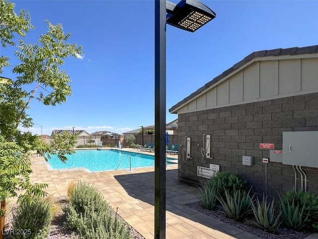 view of swimming pool with a patio area