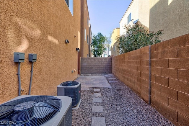 exterior space featuring a patio and central AC