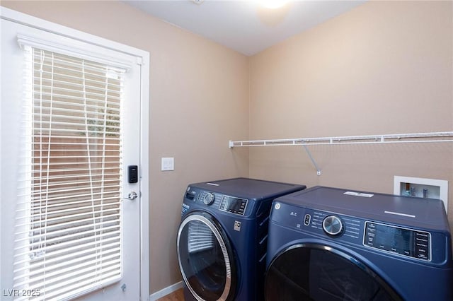 laundry area with washing machine and clothes dryer