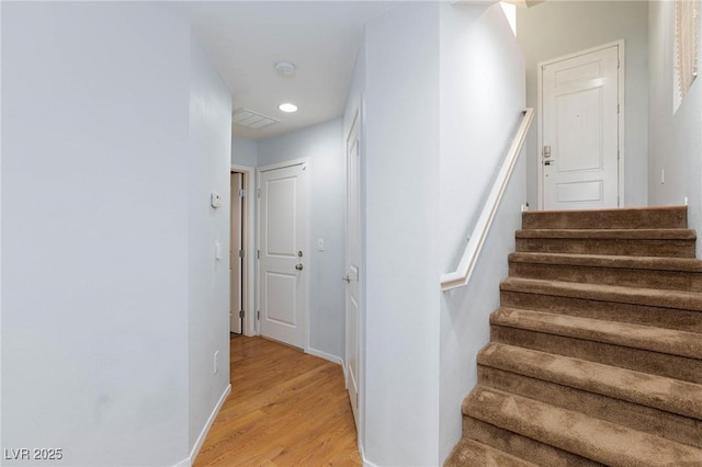 staircase featuring hardwood / wood-style flooring