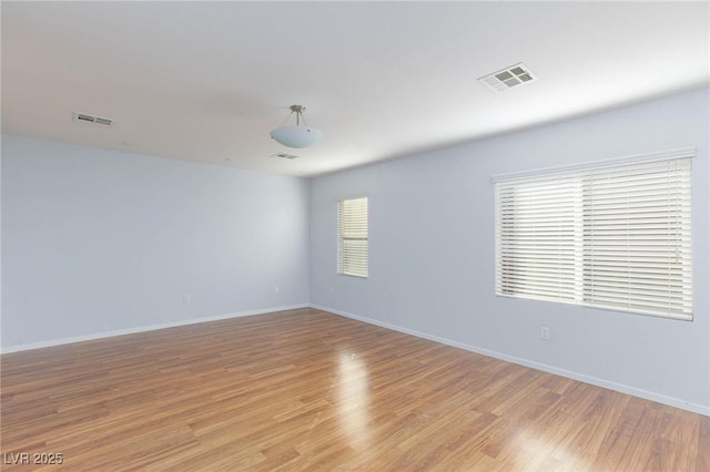 empty room with light wood-type flooring