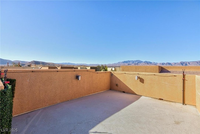 view of patio / terrace with a mountain view