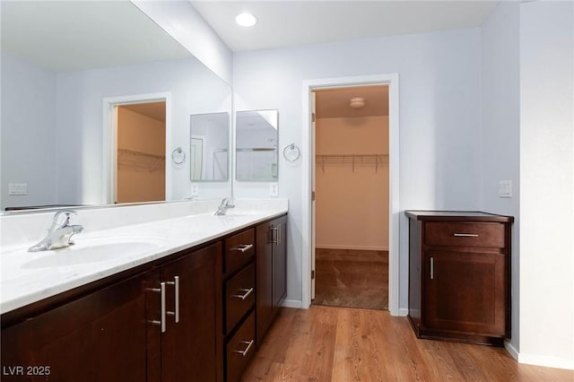 bathroom featuring vanity and wood-type flooring