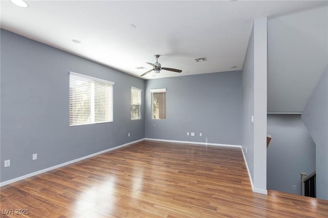 unfurnished room with wood-type flooring and ceiling fan