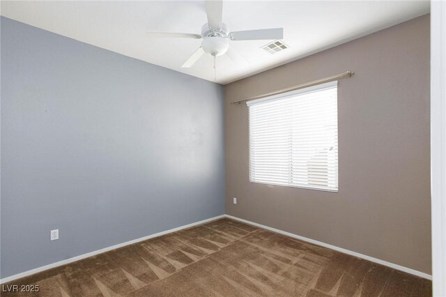 spare room with ceiling fan and carpet floors