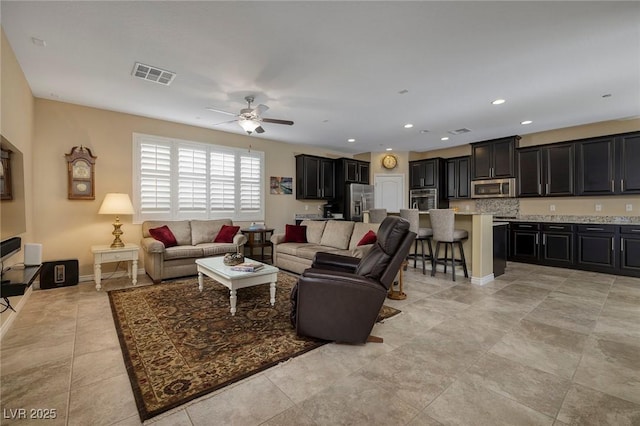 living room featuring ceiling fan