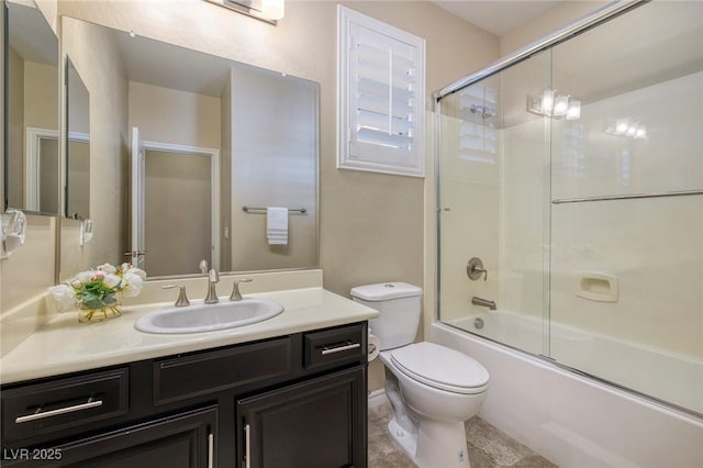 full bathroom featuring a notable chandelier, shower / bath combination with glass door, vanity, and toilet