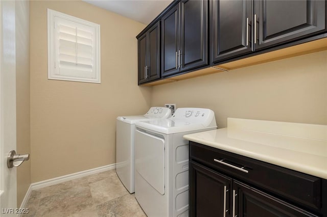 laundry area with cabinets and independent washer and dryer