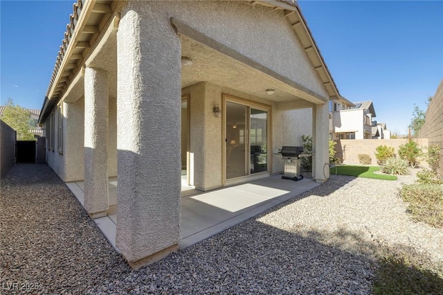 back of property featuring a patio area