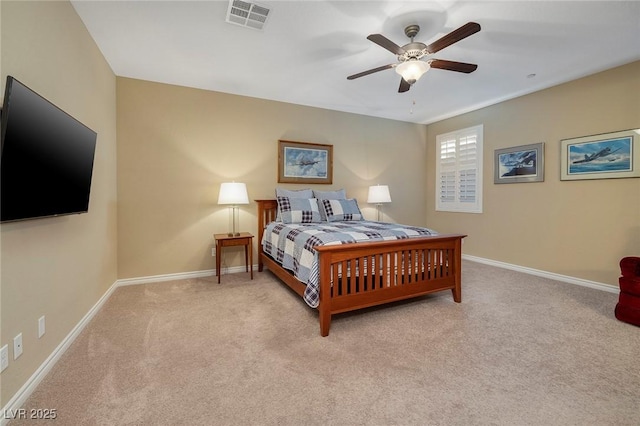 bedroom with ceiling fan and light colored carpet