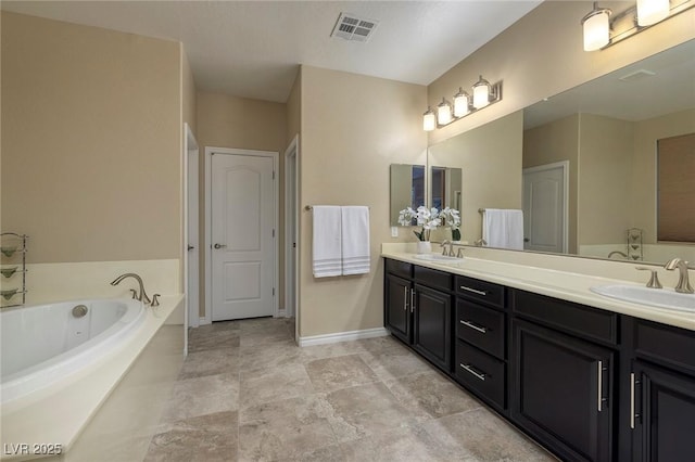 bathroom featuring a tub to relax in and vanity