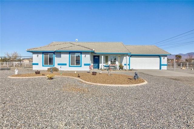 single story home featuring a garage