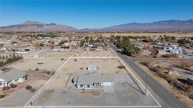 birds eye view of property with a mountain view