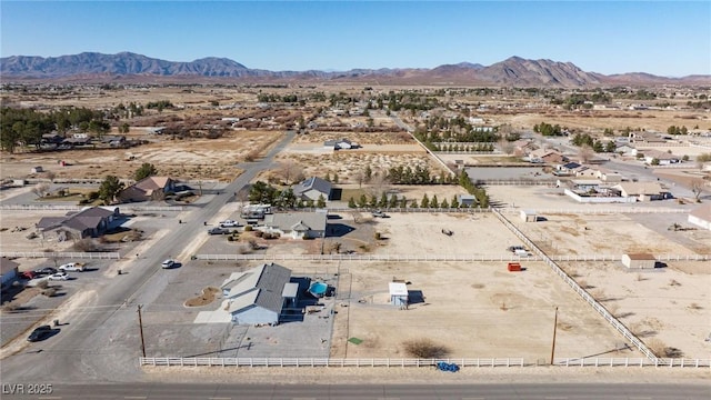 birds eye view of property with a mountain view